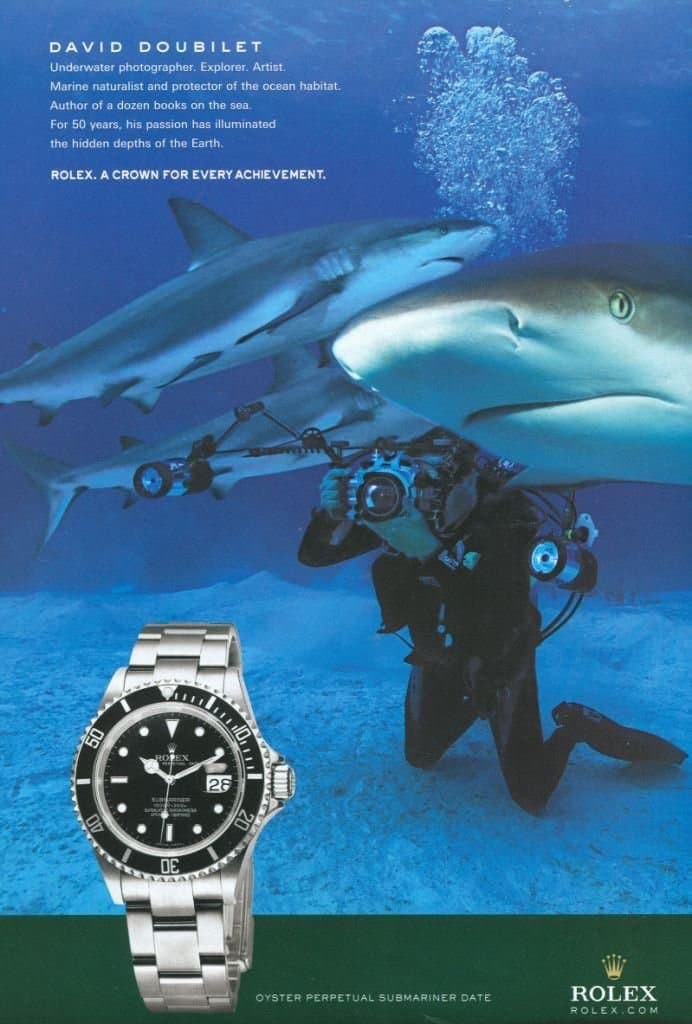 Rolex ad underwater with sharks.